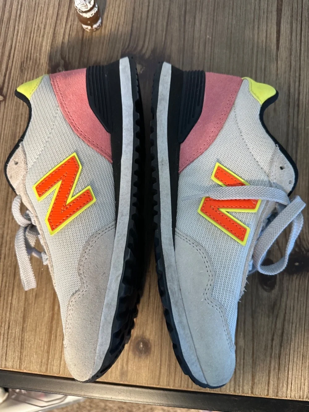New Balance tennis shoes, gray with yellow and black trim, pink suede, size 7.5